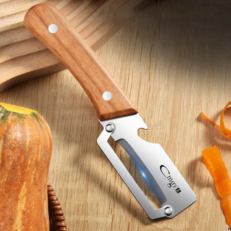 Stainless steel vegetable peeler with wooden handle ideal for slicing fruits and vegetables.