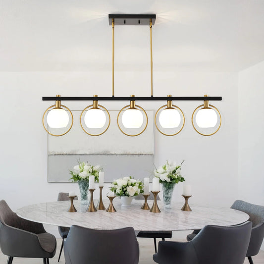 Modern chandelier pendant light featuring five adjustable glass shades in a sleek black and gold design over a dining table.